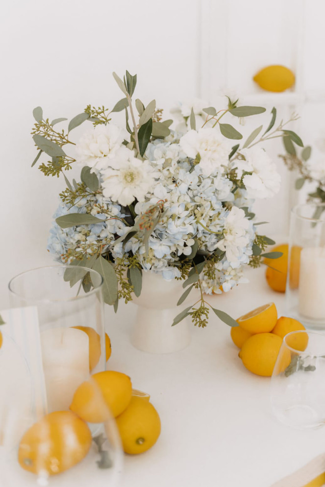 Floral centrepiece with light blue hydrangeas and white carnations